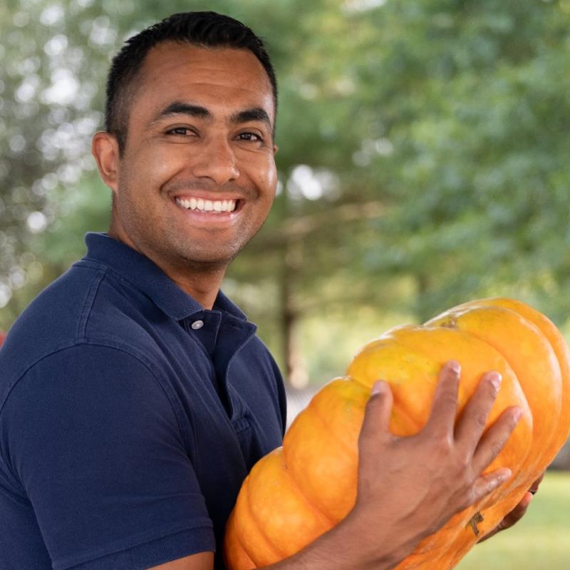 man holding a pumpkin
